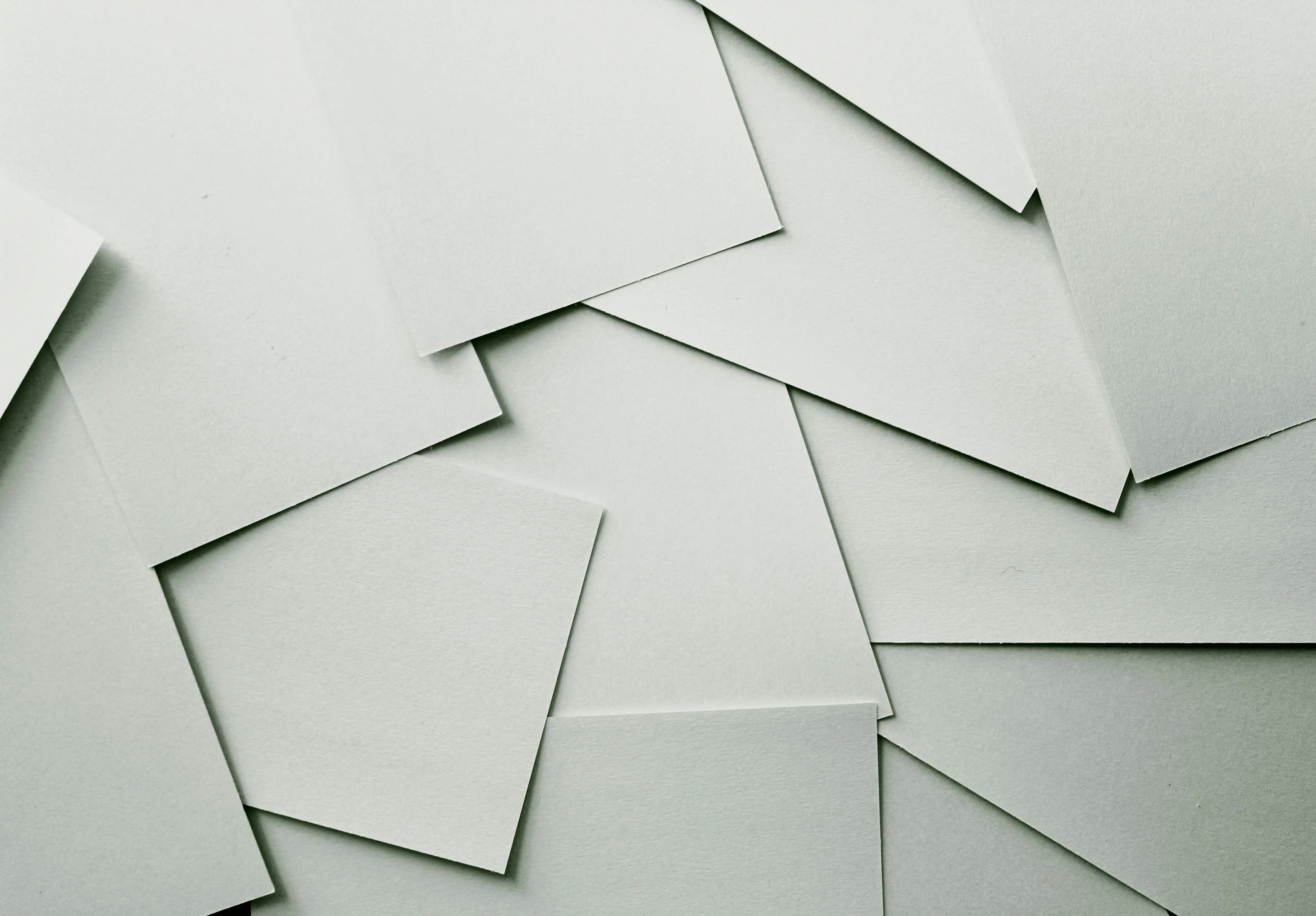 A person writing on a typewriter with a focused expression.